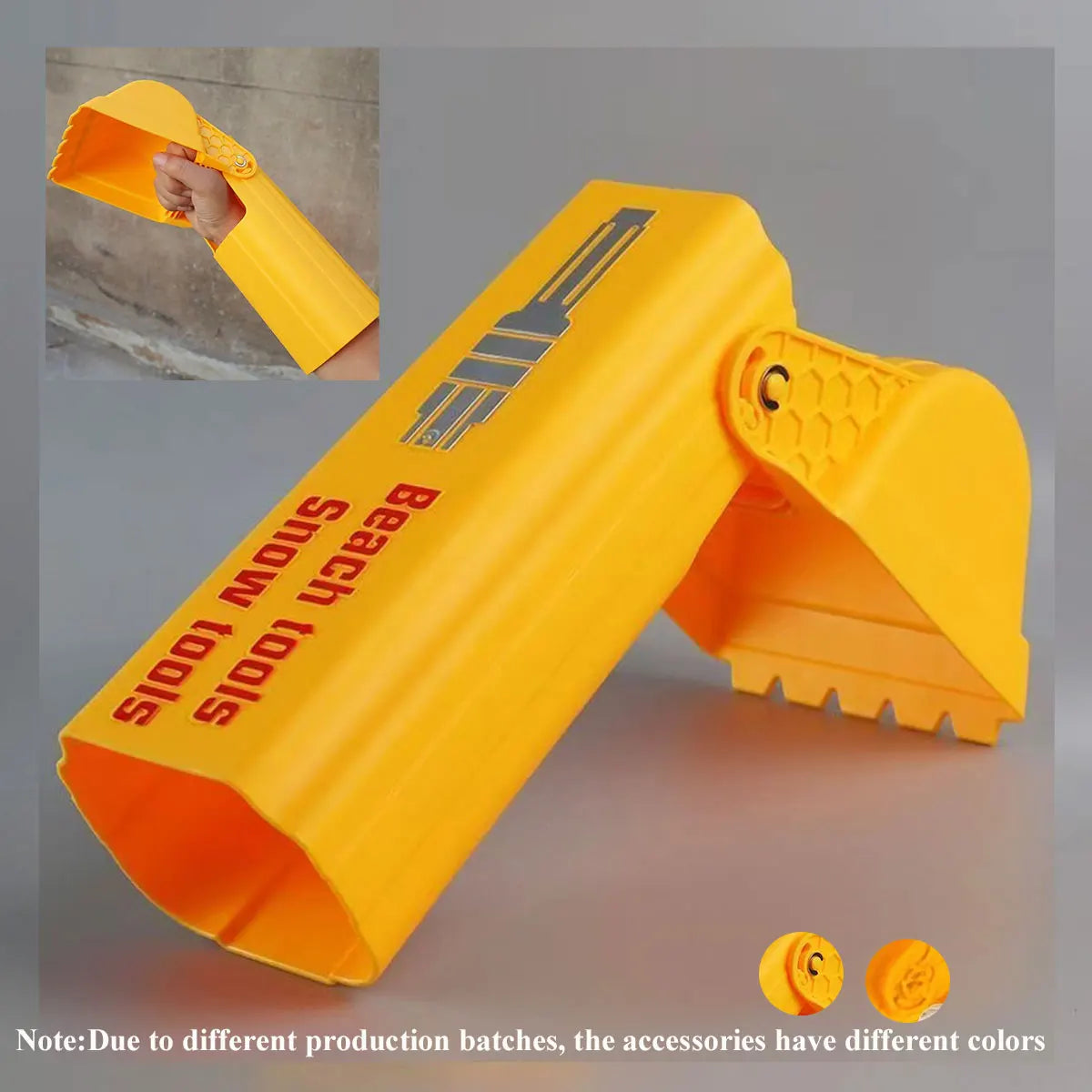 A bright yellow kids excavator digging toy tool for sand and snow