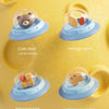 A yellow silicone bath toy organizer featuring three clear silicone spinners for baby bath time