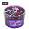 A jar of purple grape slime putty with small pink glitter pieces inside.