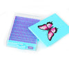 A bright blue diamond painting storage organizer box with a clear tray filled with pink and purple beads.