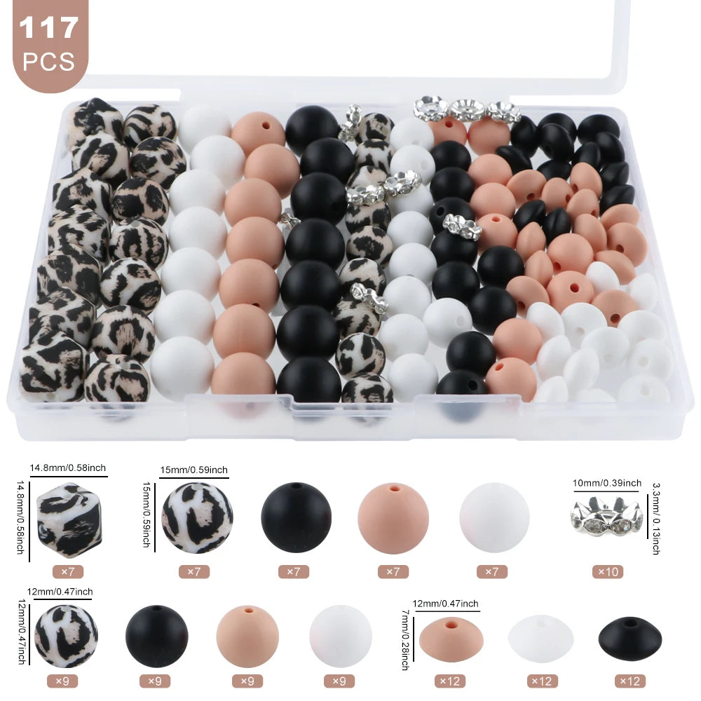 A clear plastic box containing 117 mixed beads and rhinestones for jewelry making, including various sizes and colors.