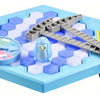 A blue hexagonal game board with wooden pieces and a small blue penguin figure for a family party game