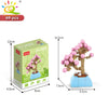 A set of 69 pieces of floral building blocks for creating desktop plant decor featuring pink and green elements.