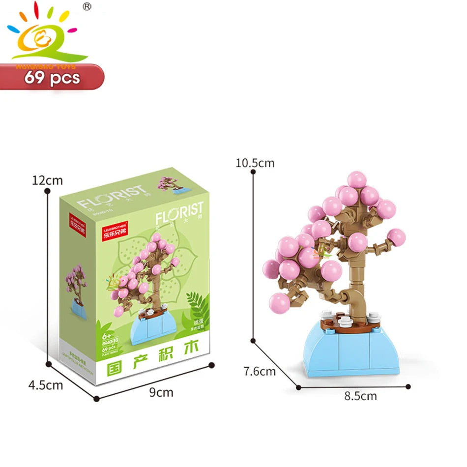 A set of 69 pieces of floral building blocks for creating desktop plant decor featuring pink and green elements.