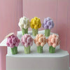 A collection of silicone molds shaped like tulips in various pastel colors including white, yellow, purple, and pink