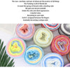 A collection of colorful gradient rainbow yarn balls for knitting and crochet