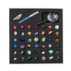 A black gift box containing a collection of various natural crystals and minerals, including quartz, amethyst, and various co