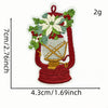 A 2-gram iron-on patch depicting a festive cartoon character in the shape of a teapot with greenery and flowers.