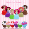 A set of cupcake princess dolls with various hair colors and colorful dresses displayed against a pink striped background.