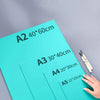 A variety of A2 to A5 sized rubber plates for engraving and block printing are displayed on a gray surface.