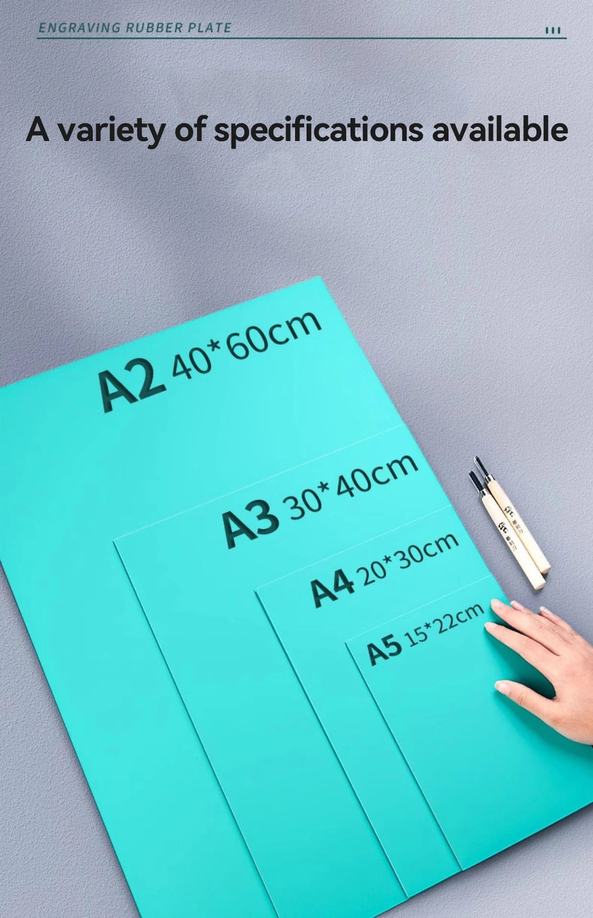 A variety of A2 to A5 sized rubber plates for engraving and block printing are displayed on a gray surface.