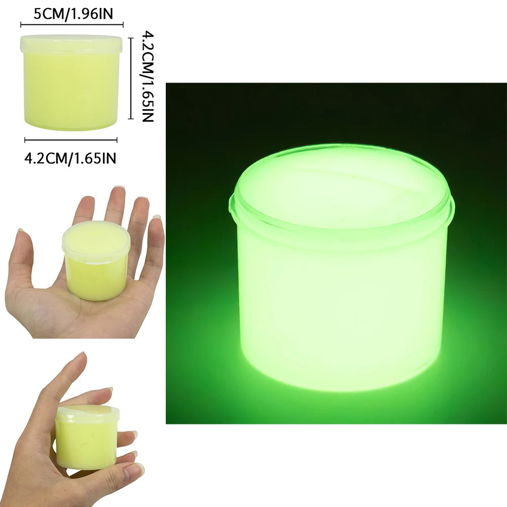A clear plastic container of glow-in-the-dark crystal slime, emitting a bright green light.