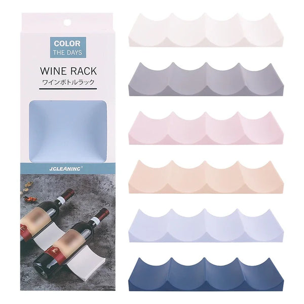 A set of stackable plastic wine rack inserts in various shades of blue, pink, and beige for storing wine bottles.