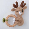 A handcrafted brown felted animal rattle and teether ring shaped like an otter.
