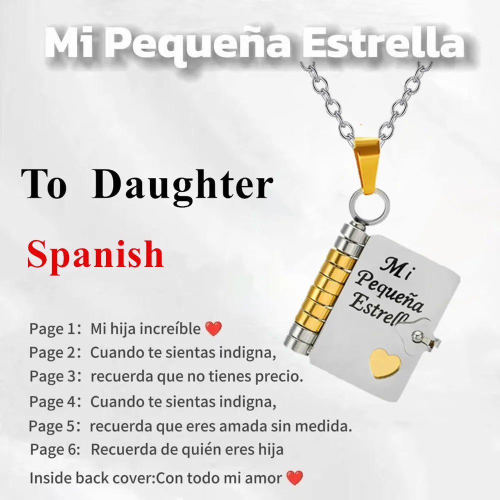 A gold chain necklace with a silver pendant engraved with Spanish words for daughter