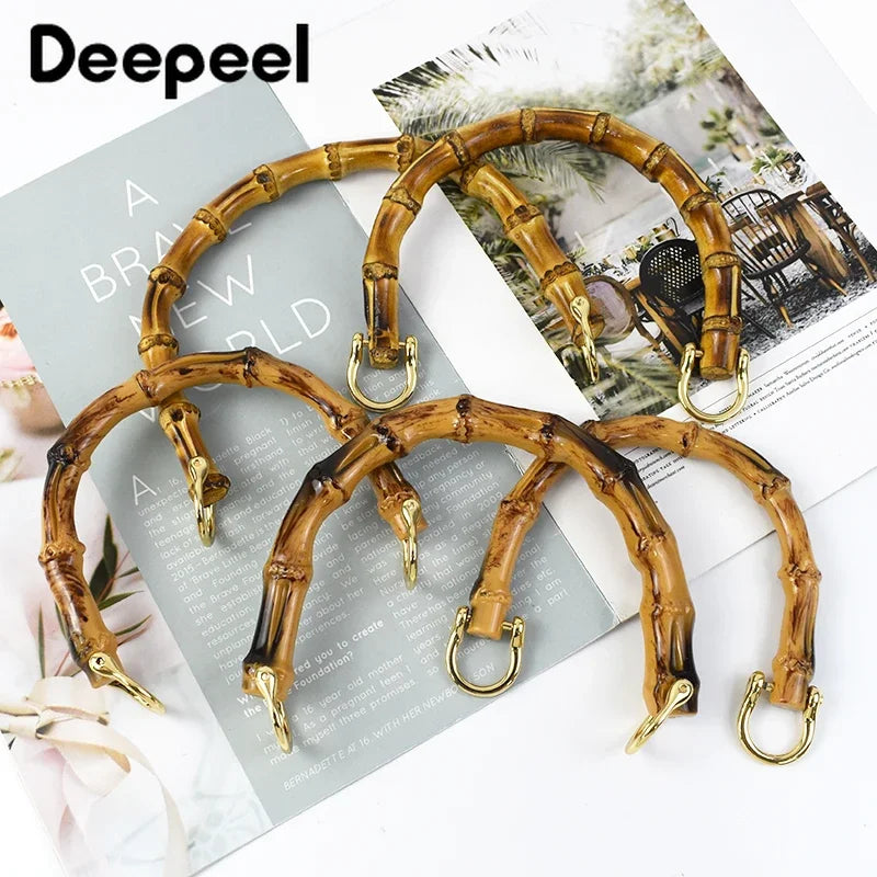 A set of natural bamboo-style bag handles with gold-colored hardware for DIY projects.