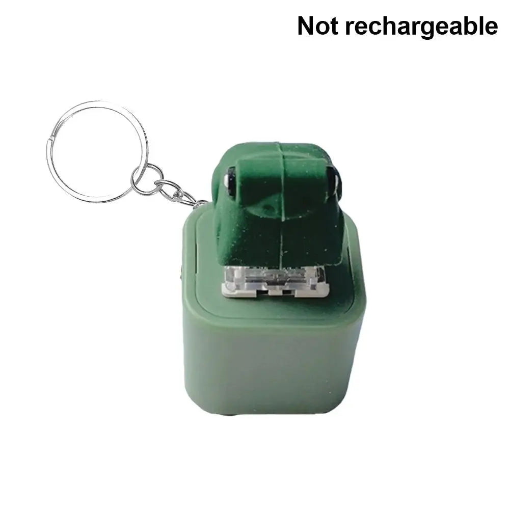 A green LED frog croaking keychain fidget toy attached to a metal ring.