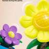 A close-up of a smooth corner design flower toy in purple and yellow colors.