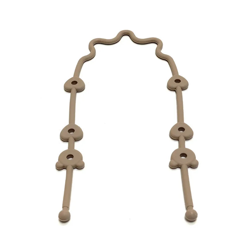 A silicone pacifier clip featuring an anti-drop chain, light beige color.