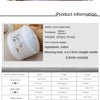A roll of light purple cotton yarn with a label indicating 100g and a nearby wooden spool.