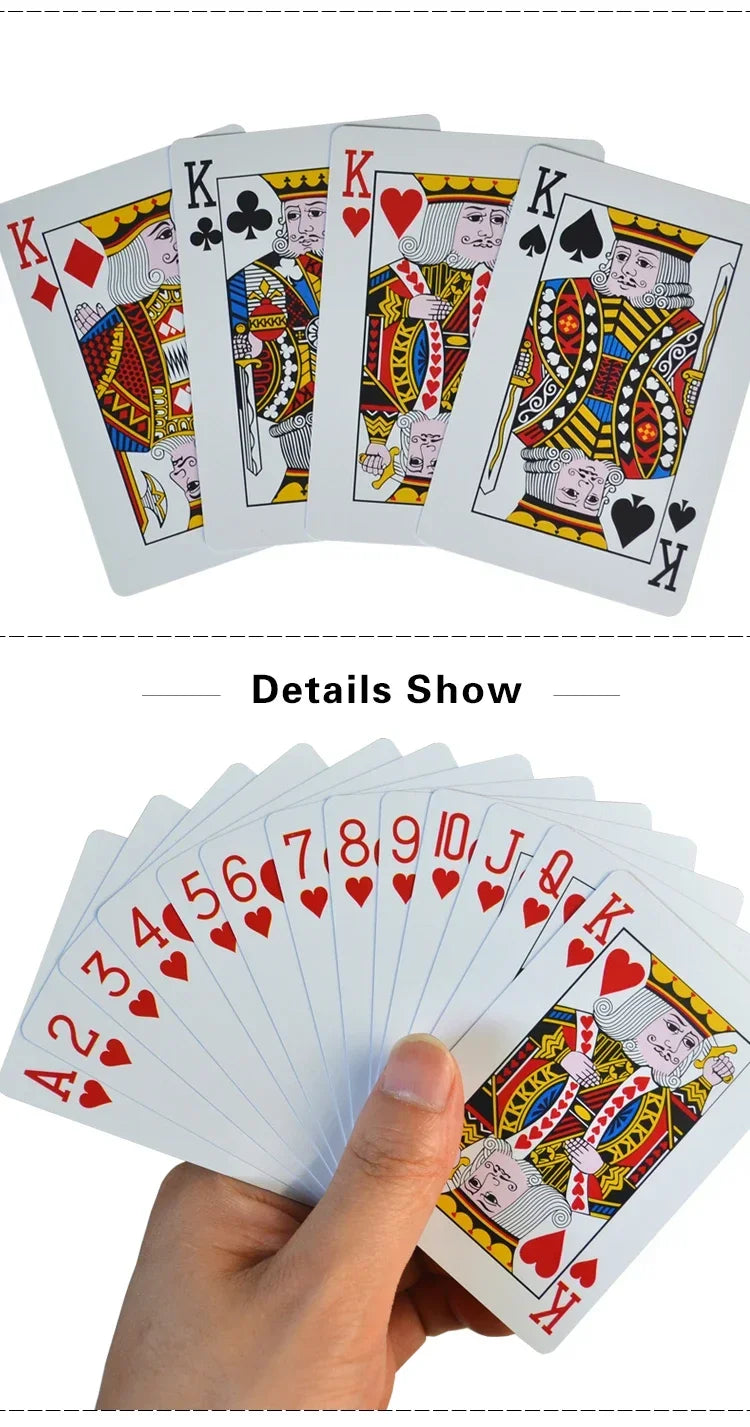 A hand holds a fan of waterproof plastic playing cards showing various face cards and aces.