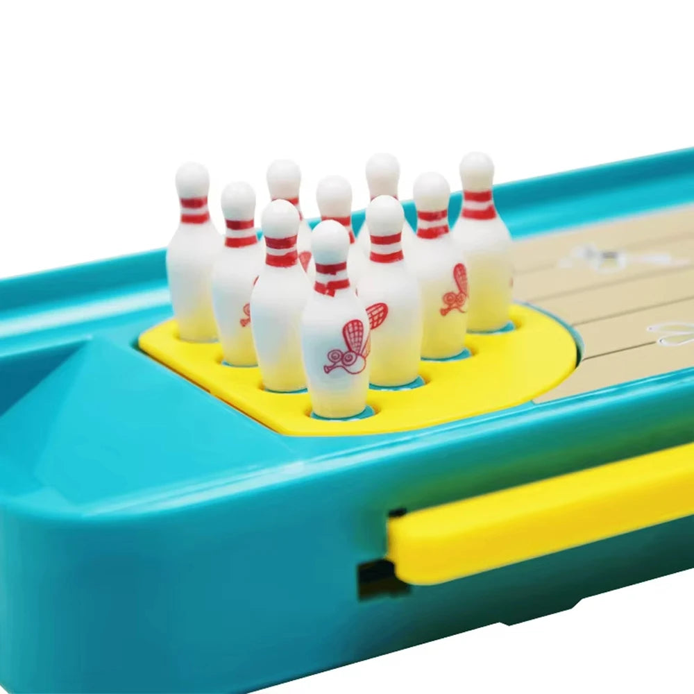 A mini frog bowling game set with ten white and red bowling pins arranged in a yellow tray.