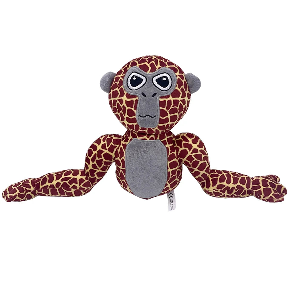 A plush toy of a monke gorilla with brown and black spotted fur and gray features.