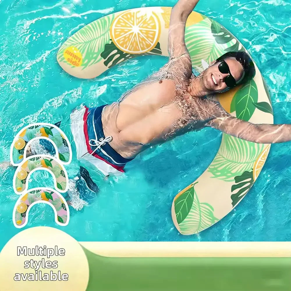 A man is floating on a yellow inflatable U-shaped swim ring in clear blue water.