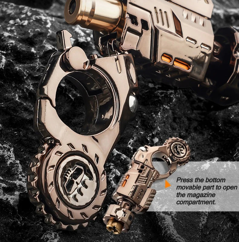 A close-up of a metallic toy pistol and fidget spinner set with ejecting shell mechanism resting on a dark surface.