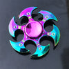 A rainbow metal fidget spinner with smooth silent rotation, featuring iridescent purple and blue blades.