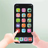 A hand is interacting with a smartphone displaying various colorful icons for baby learning games and music.