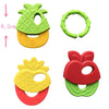 A set of silicone baby teethers shaped like a pineapple, apple, and lemon in green, yellow, and red colors.