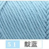 A close-up of light blue premium milk cotton yarn showing a knitted texture.