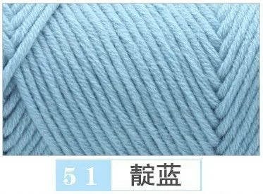 A close-up of light blue premium milk cotton yarn showing a knitted texture.