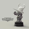 A handcrafted PVC figure of the Hollow Knight Little Knight collectible statue standing on a base.