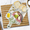 A silicone resin casting mold set is displayed on a cutting board with eggs, herbs, and a pestle.