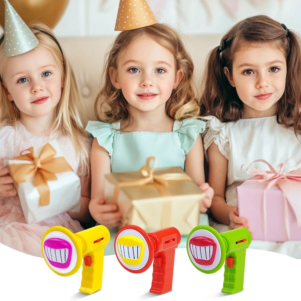 A set of three colorful kids voice changer toys with yellow, red, and green casings shown in front of three smiling young gir