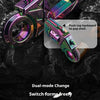 A close-up of a dual-mode metal gun-shaped fidget slider in iridescent purple and green colors resting on a dark surface.