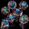 A collection of seven polyhedral resin dice with iridescent blue and green liquid core eyes set against a dark background.
