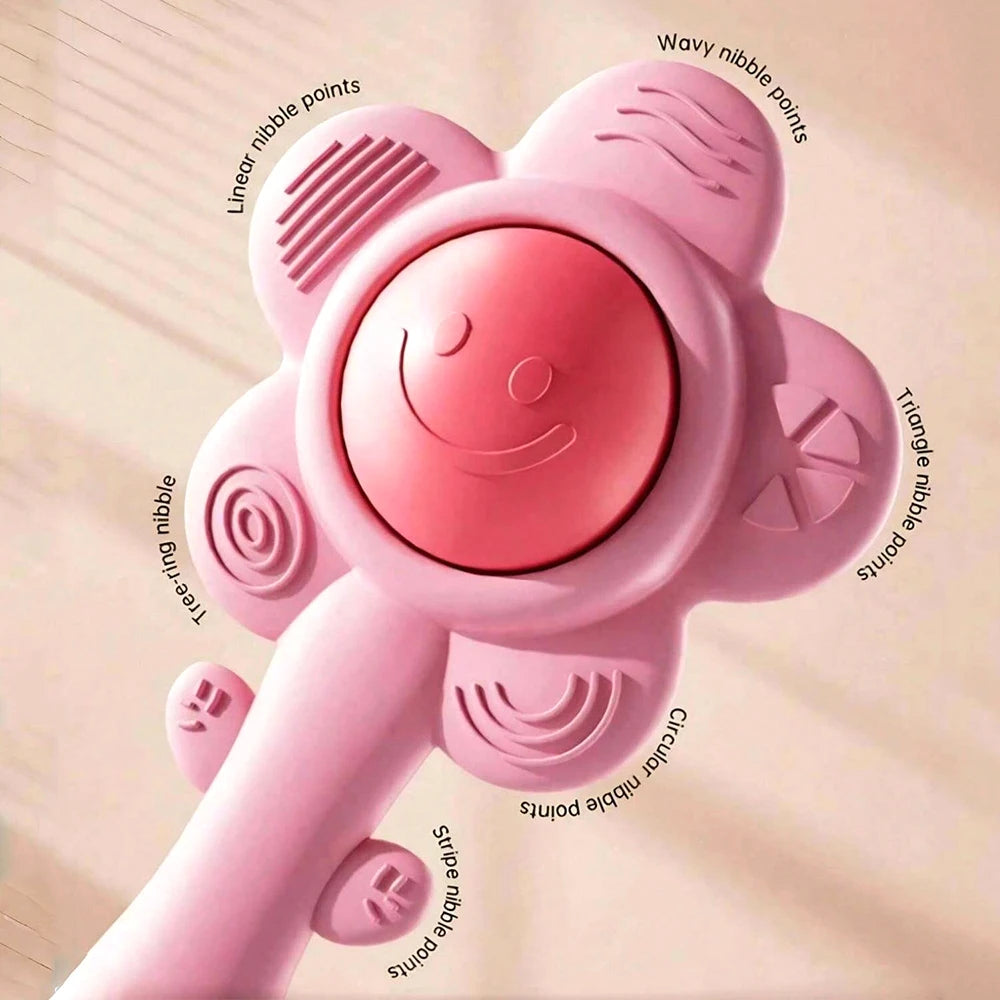 A pink 3-in-1 sensory teething rattle for babies with various nipple points.