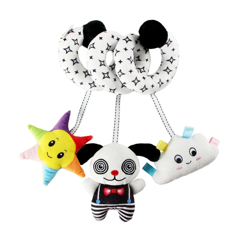 A set of spiral elephant sensory toys with black and white patterns for babies.