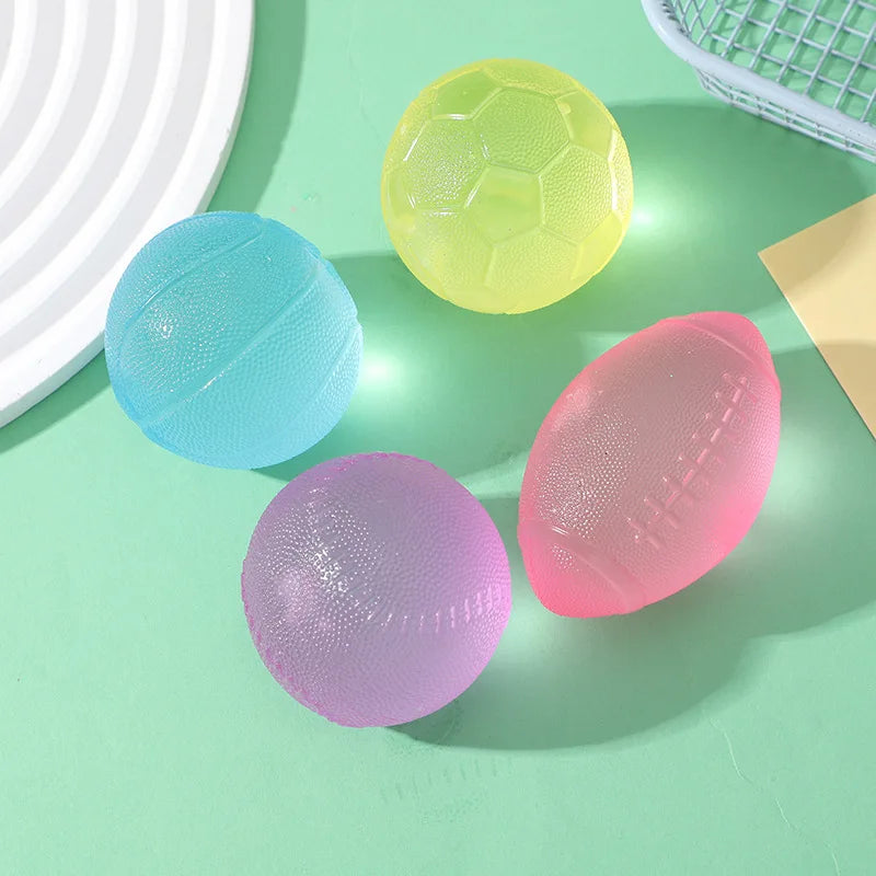 A collection of colorful, translucent squishy fidget toys shaped like footballs in yellow, blue, and pink.