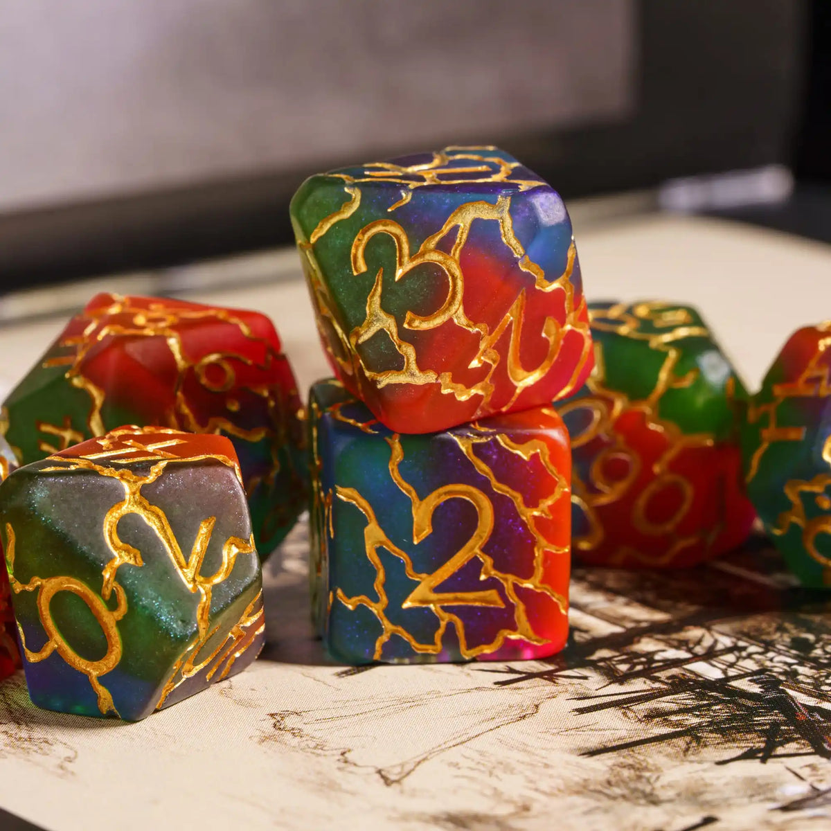 A close-up of seven frosted crack resin polyhedral dice in various colors including green, red, and blue.