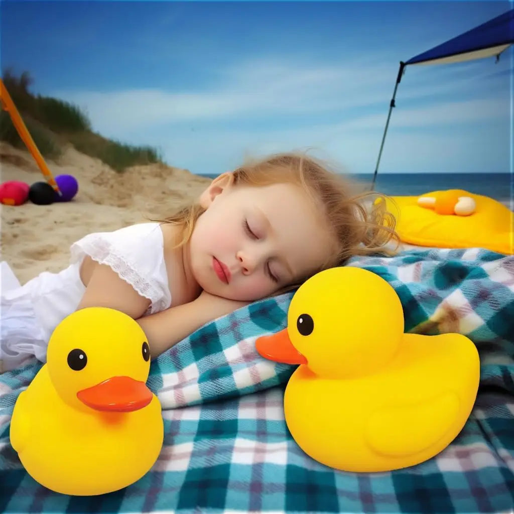 A small yellow rubber duck resting on a blue checkered blanket with a child in the background.