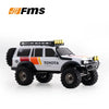 A white 1:18 scale remote control off-road climbing Toyota jeep with a roof rack and yellow lights.