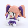 A soft collectible doll plush toy with pink hair and purple clothing.