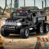 A black SWAT City Police truck diecast toy with lights and sounds parked on a dusty ground.