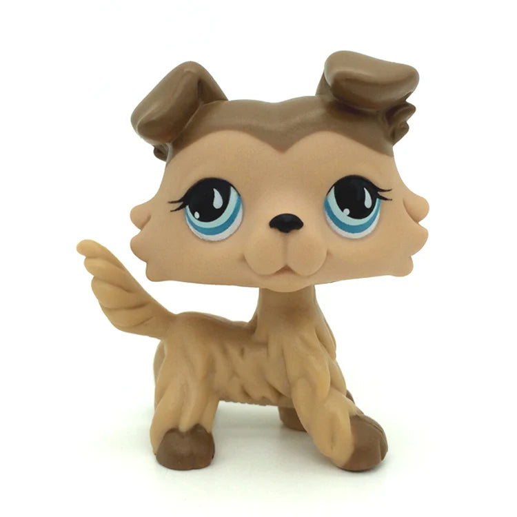 A small, tan and brown Littlest Pet Shop style standing dog figure with large blue eyes.