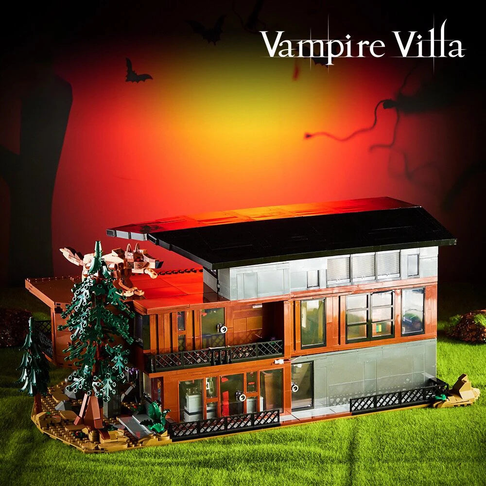 A detailed model of a Vampire Villa building set featuring a dark roof and wooden structures on green grass.