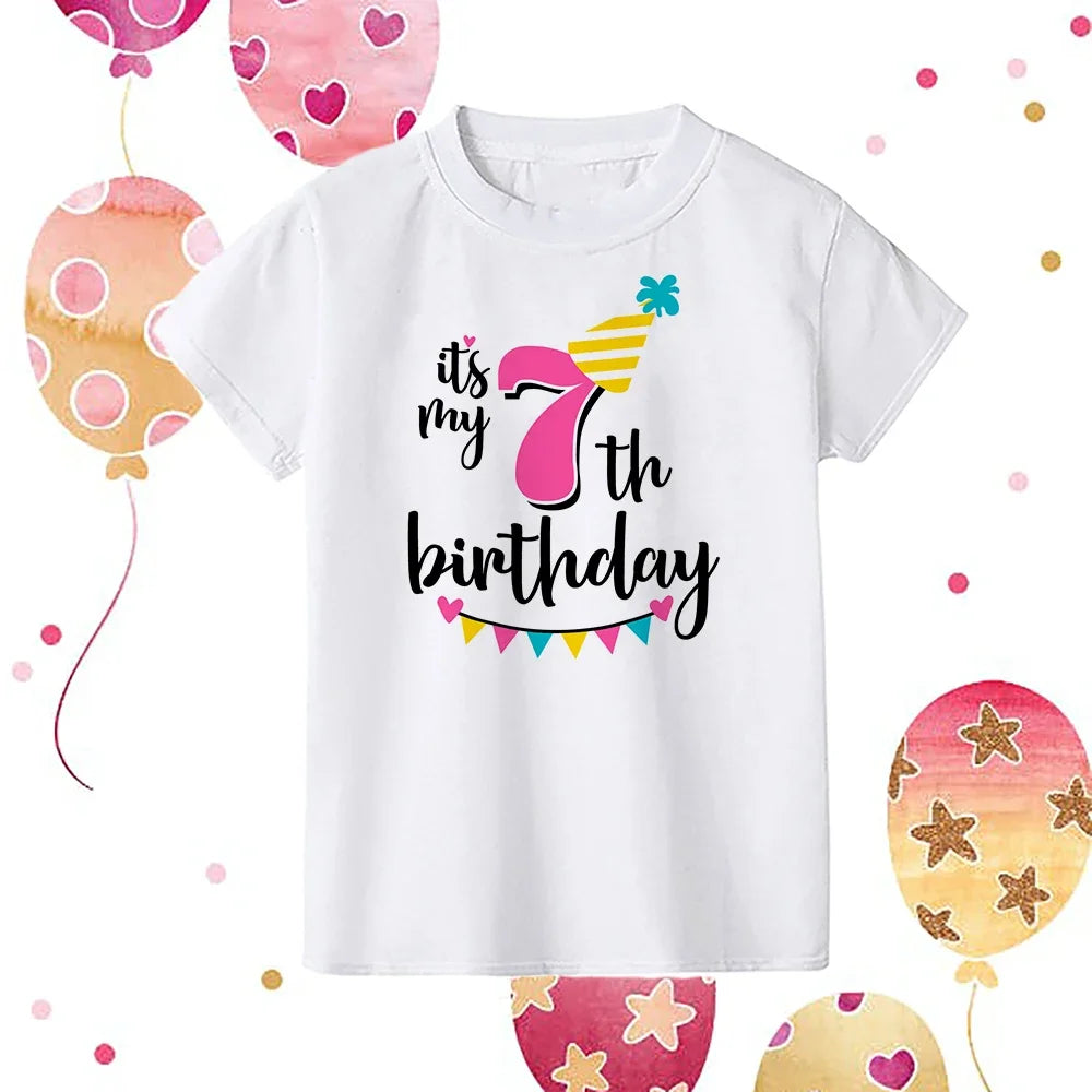 A white kids birthday number t-shirt featuring the text Its my 7th birthday with colorful decorations.